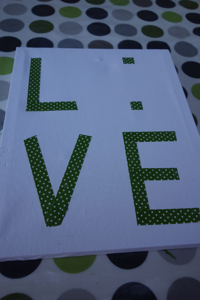 canvas with letters in tape