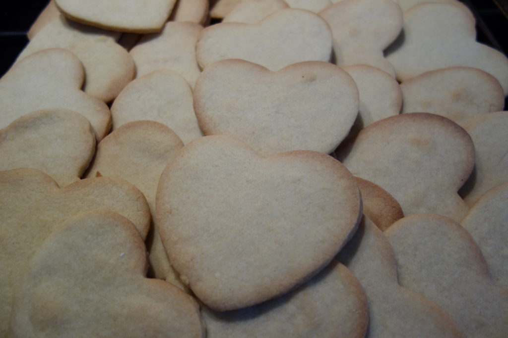 lots of baked heart shaped biscuits
