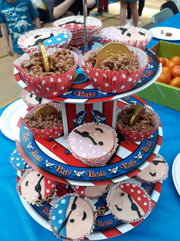 pirate cupcakes and buried treasure rice krispie cakes on a stand