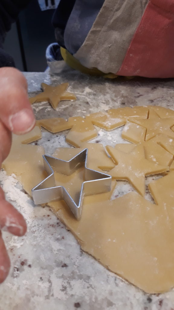 cutting out star shapes for The Magic of Baking