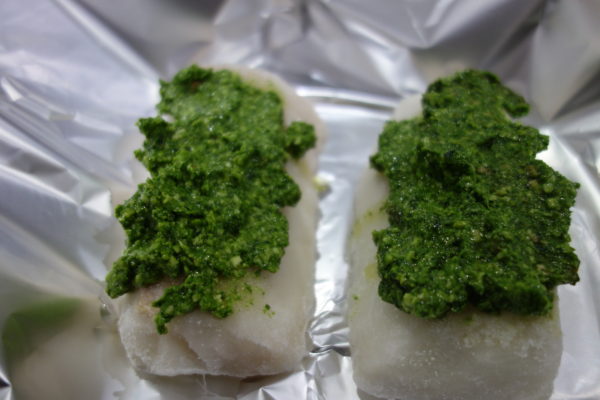raw haddock fillets with spinach pesto on top