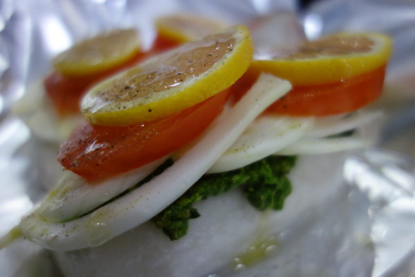 haddock fillet loaded with pesto, fennel, tomato and lemon