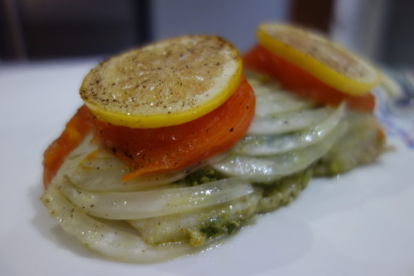 haddock fillet baked with pesto fennel tomato and lemon