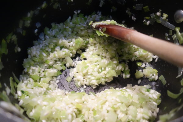 rice added to veggies in pan for Courgette Risotto recipe