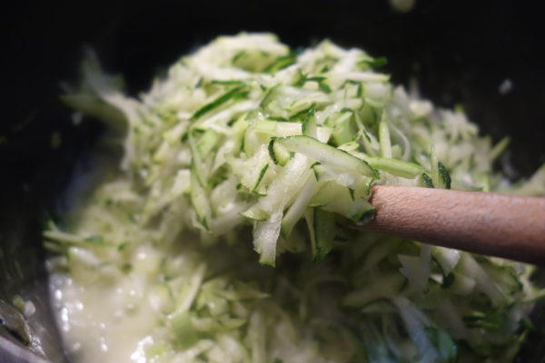 grated courgette being added to the Courgette Risotto recipe
